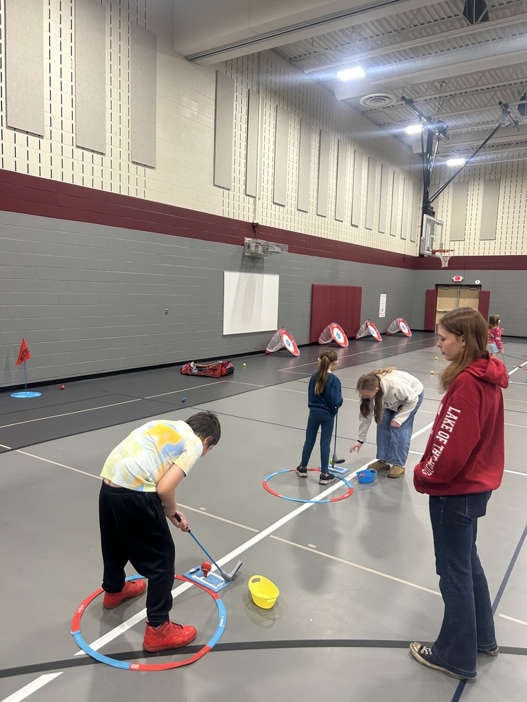 students in Adaptive PE learning how to play golf