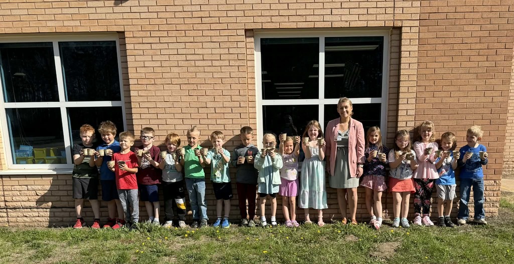 Miranda Larson with kindergartners after planting their seeds