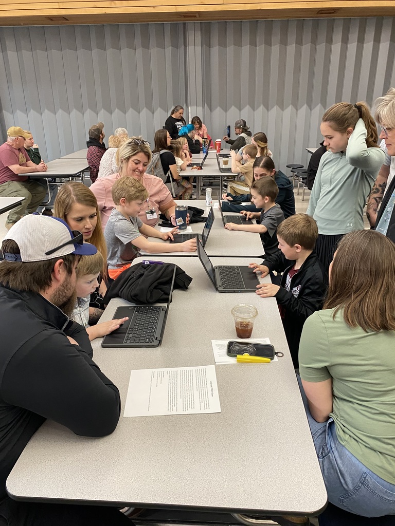1st graders at the lunch table showing their families what they learned in STEAM at their Expo