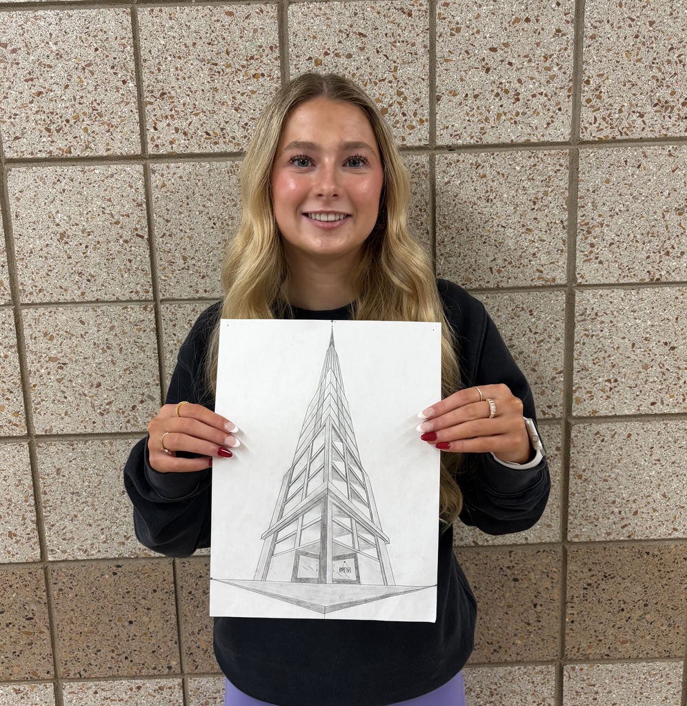 9th graders holding a perspective drawing of a tall building