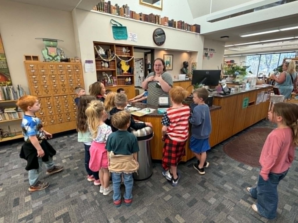 kindergartners talking to Ms. Abby the librarian