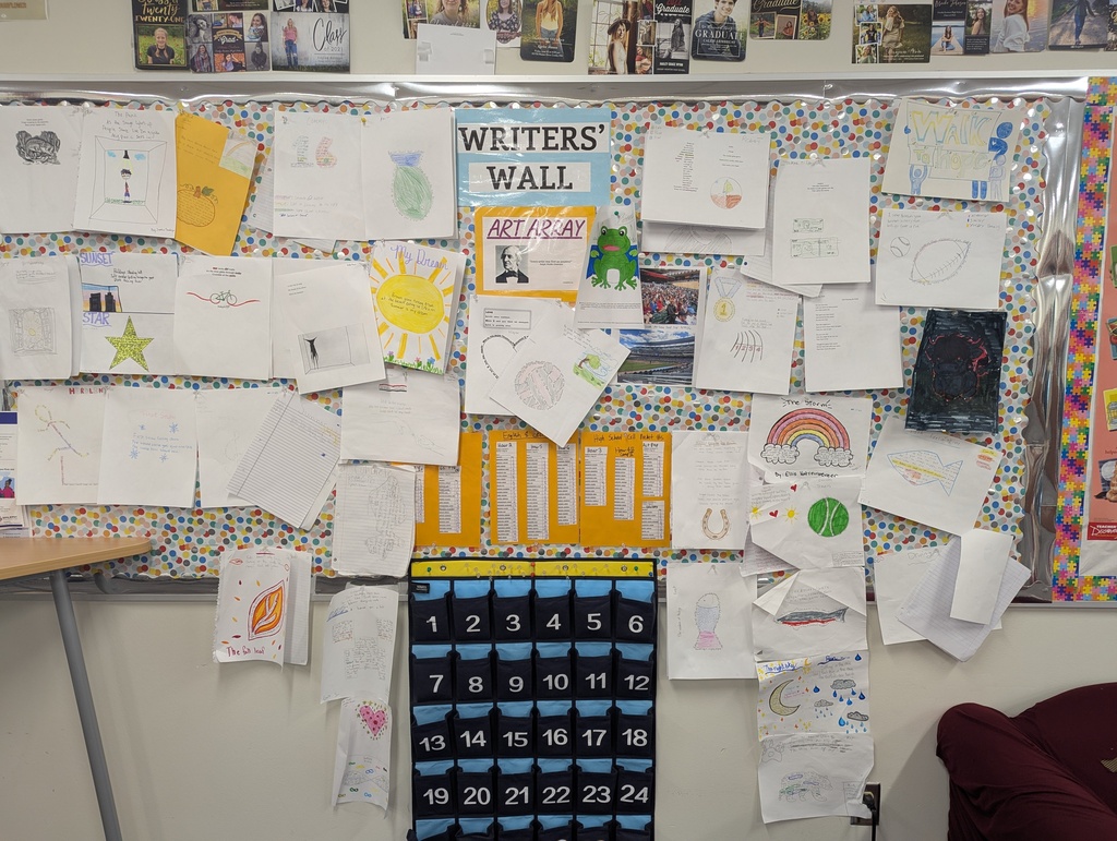8th grade english students posting their haikus on the writers wall