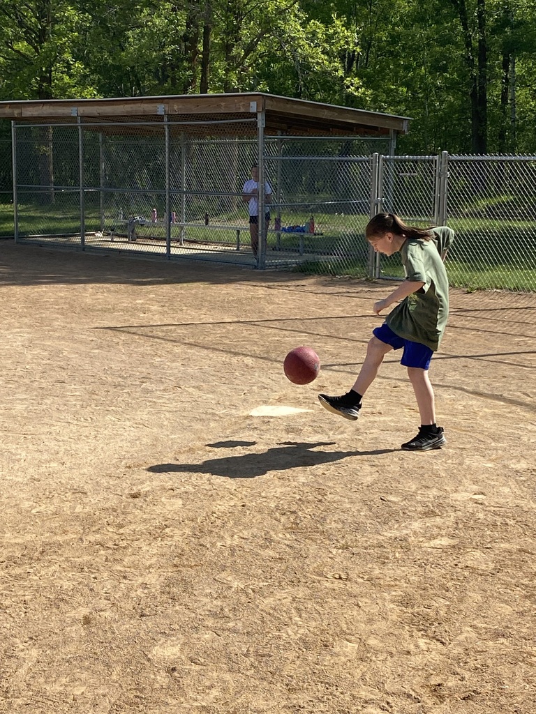 6th grader up at the plate kicking a kick ball