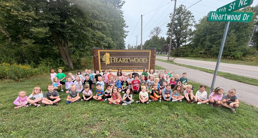 Kindergartners in front of the hearwood sign
