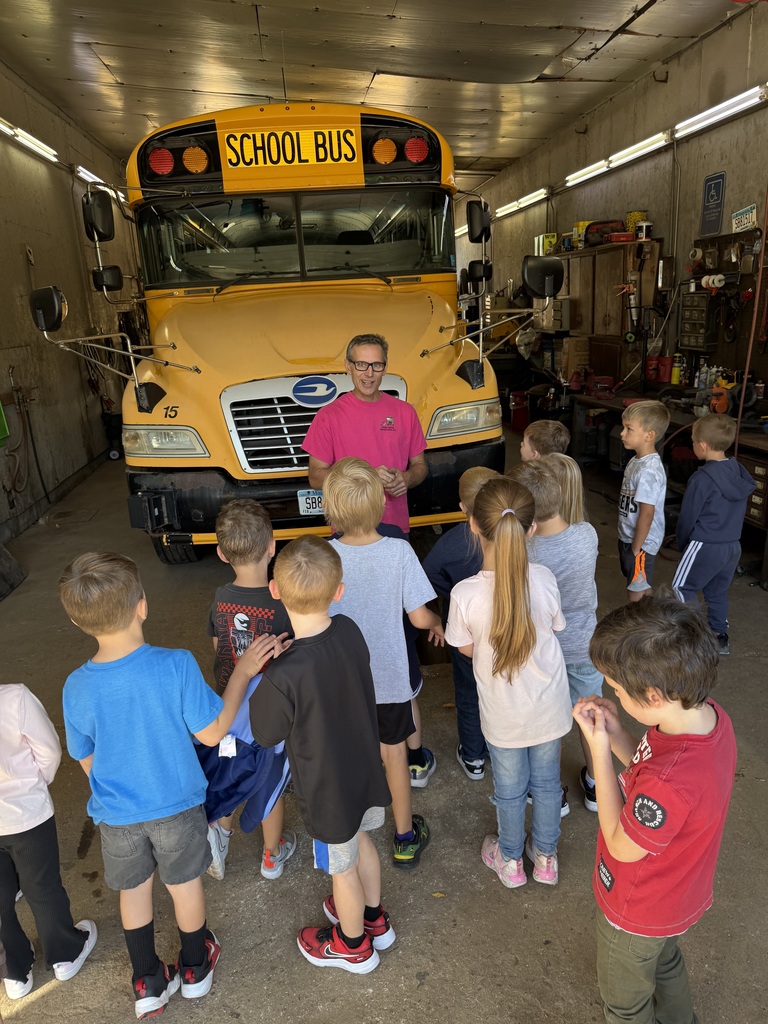 Bus garage owner, Josh, and kindergartners