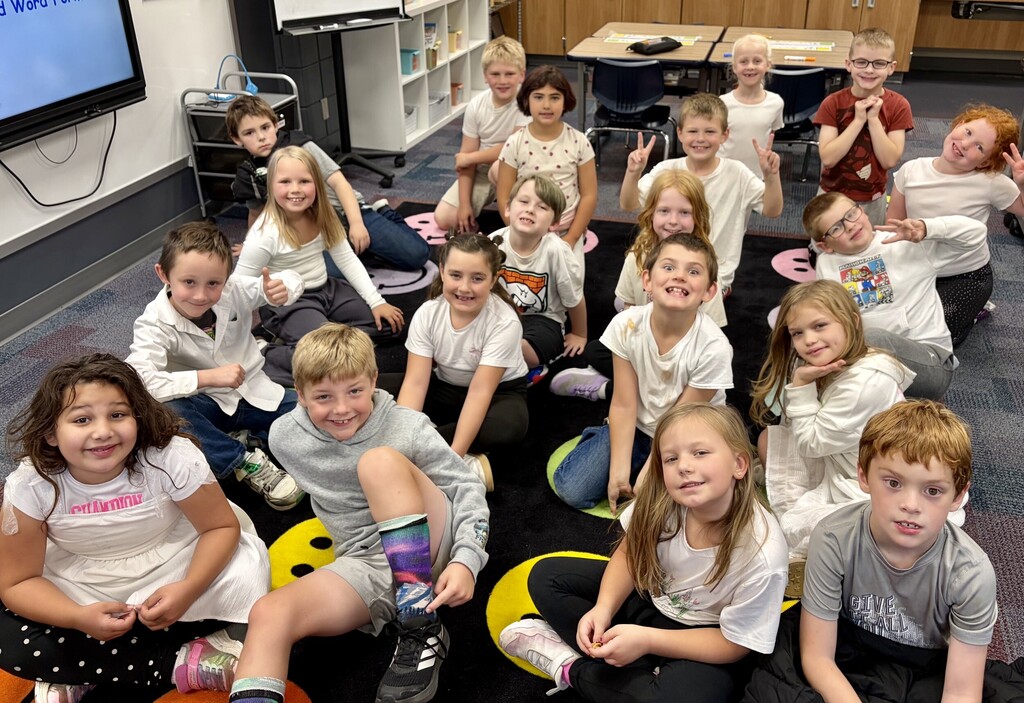 2nd graders wearing all wearing white for their homecoming dress up day