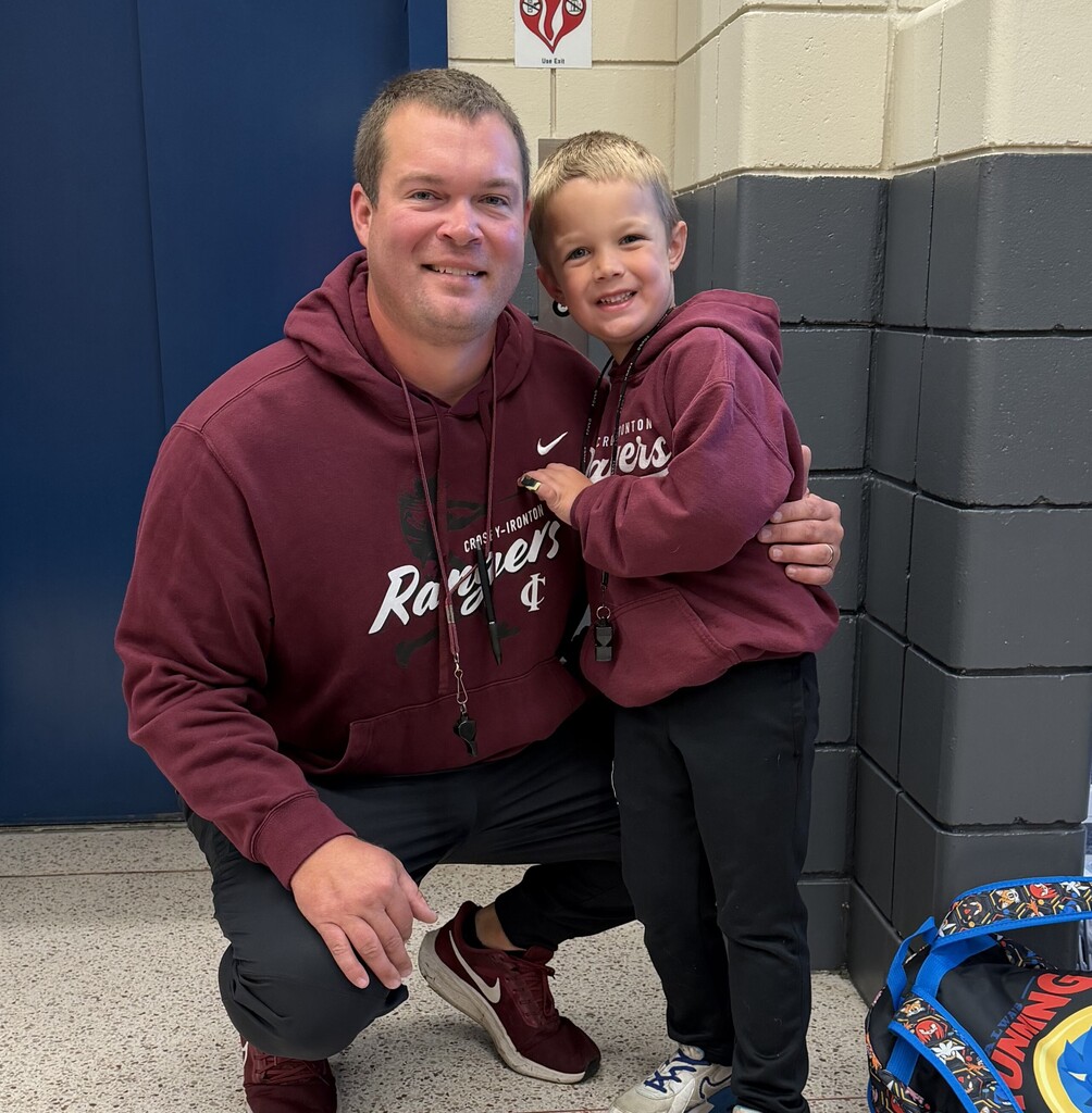 Mr. Syrstad and a male student matching wearing their Ranger sweatshirts