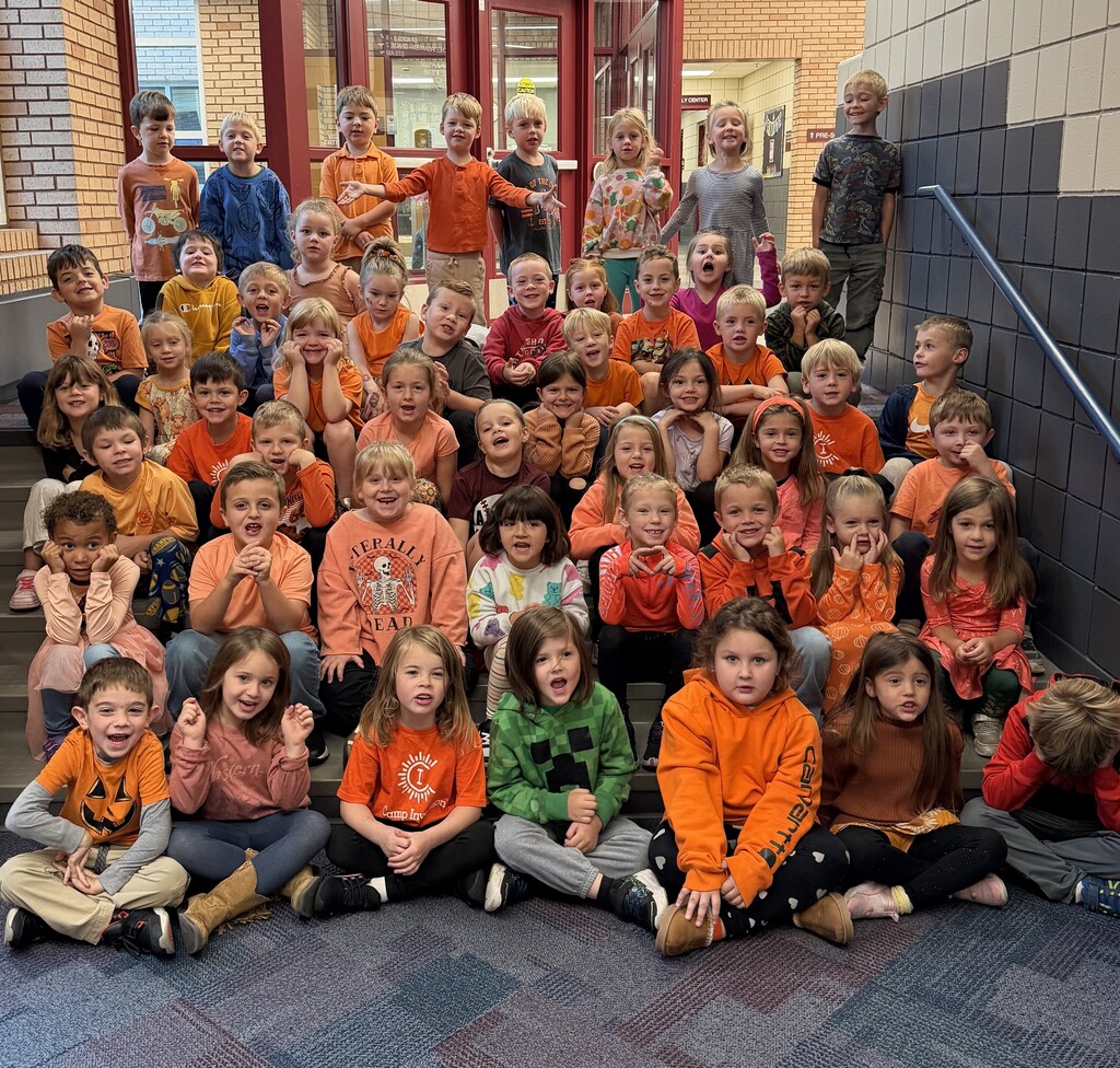 kindergarteners dressed in orange
