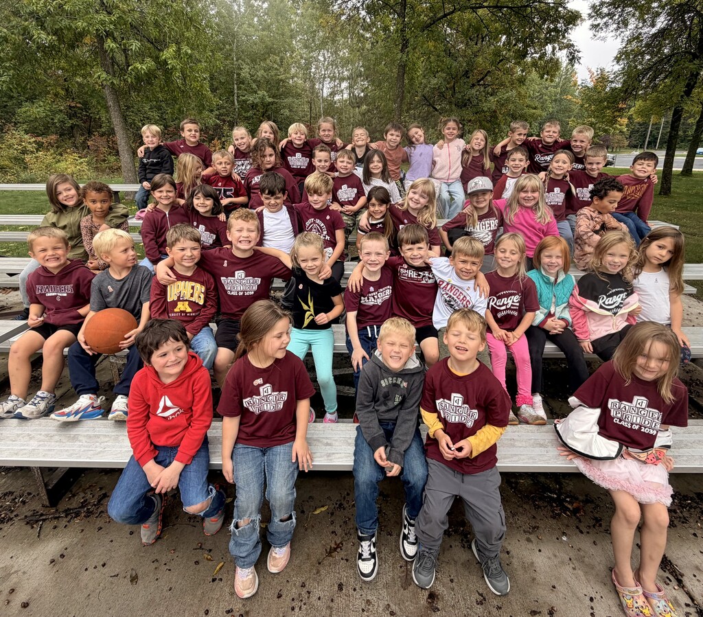 kindergartners gathered and wearing maroon and white