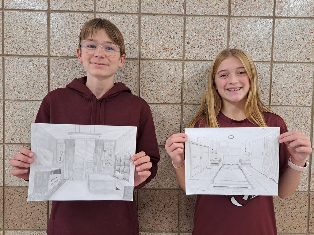 A male and a female art student with 1 point perspective drawings