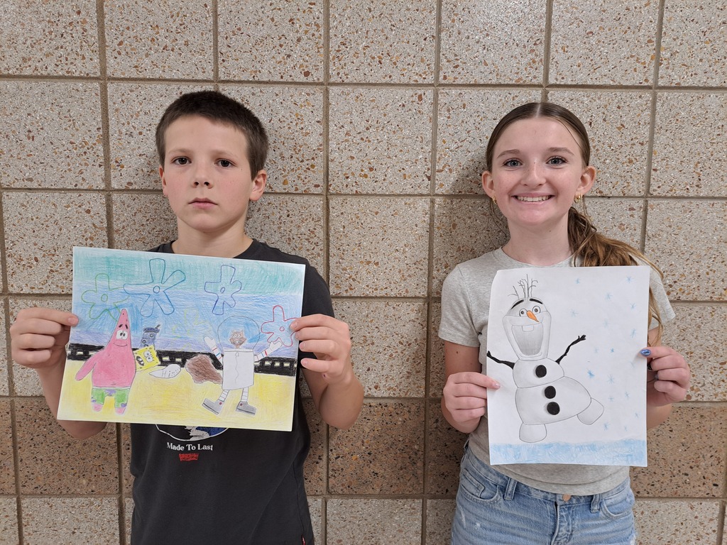 two 7th grade students holding cartoon prjects: one of sponge bob the other of olaf