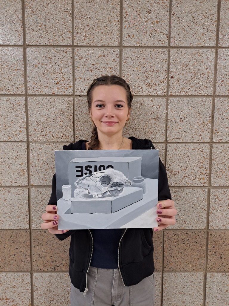 female student 9th grader holding acrylic still life drawing