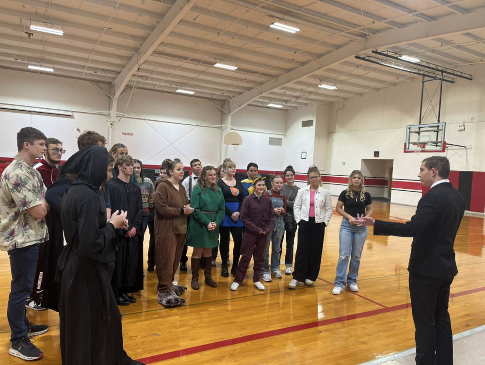Colton Duncan giving a pep right before their performance