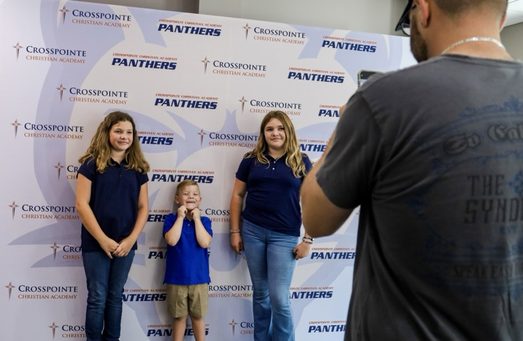 parent taking picture of students