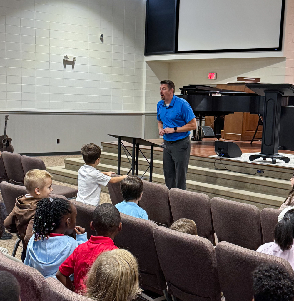 Speaker with elementary students