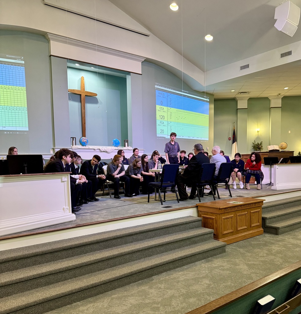 Students sitting on stage