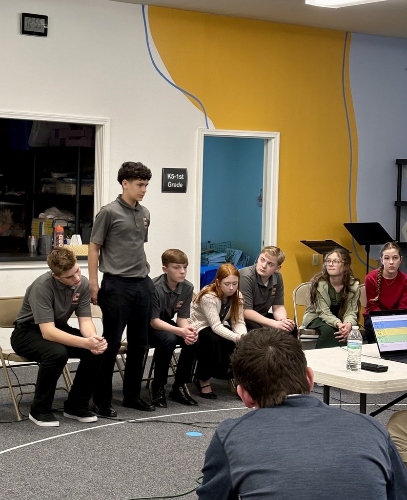 Student standing answering question