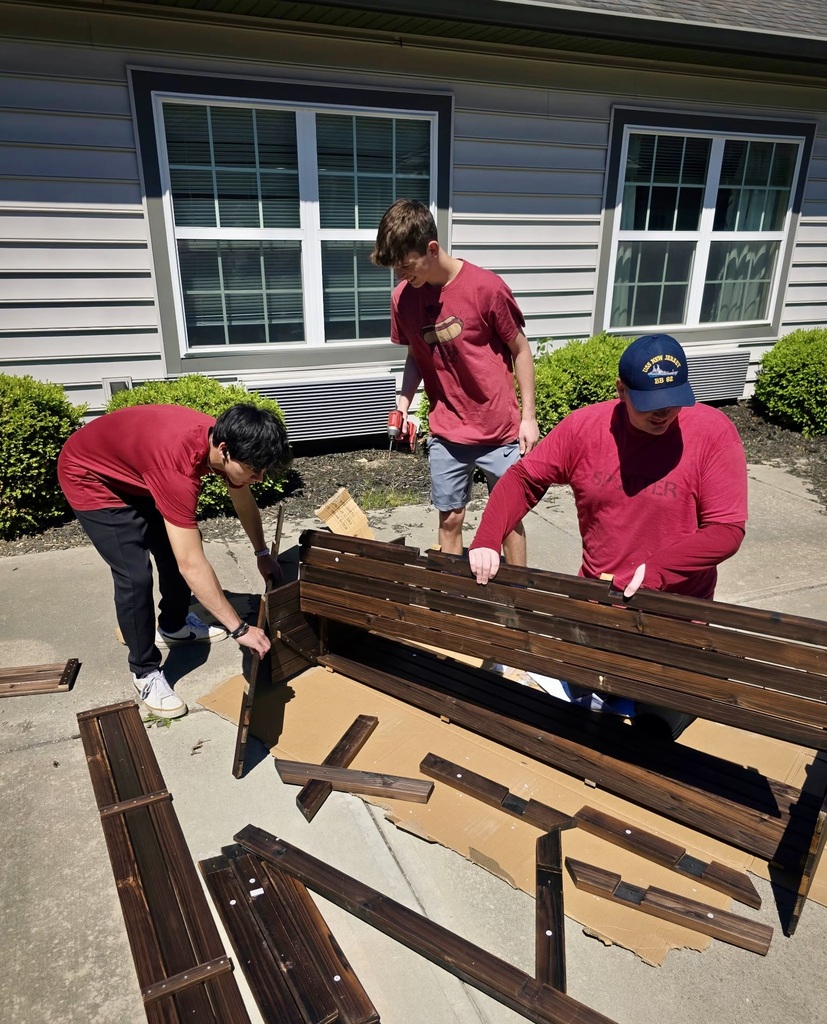 Students building bench