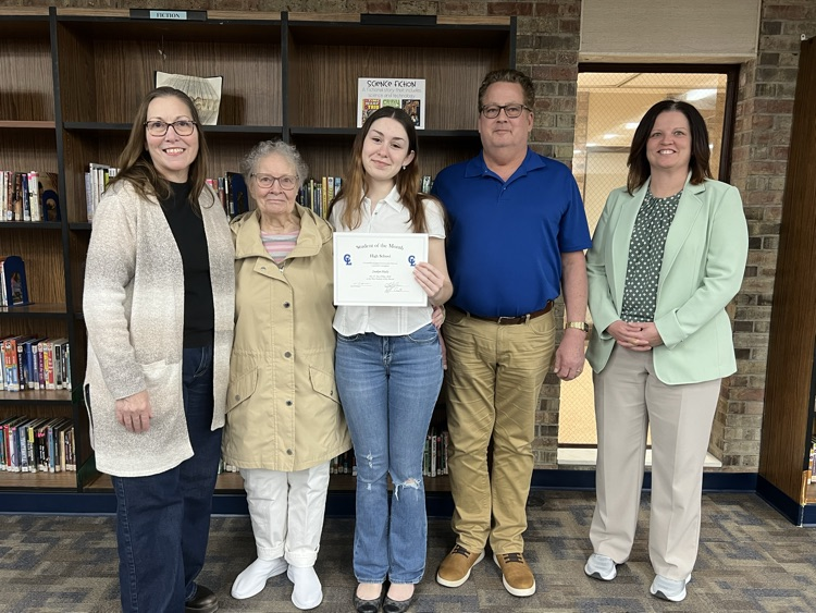 high school student of the month and family plus school staff