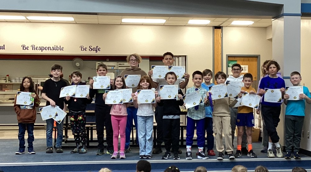 picture of a group of students holding certificates