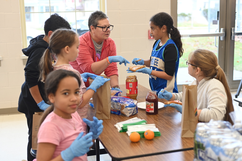 students making bagged lunches