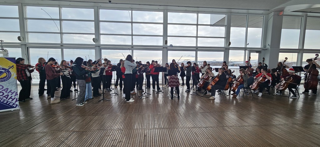 high school orchestra students at discovery world