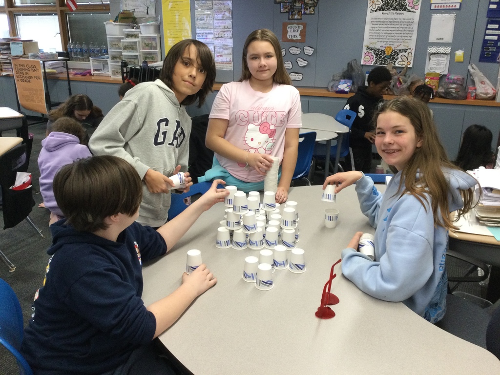 students building with 100 cups to celebrate 100 days in school