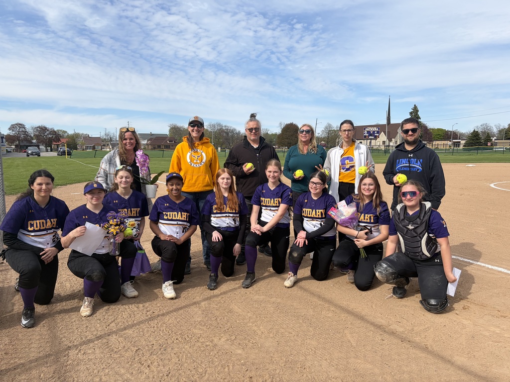 picture of the high school softball players with the honored teachers
