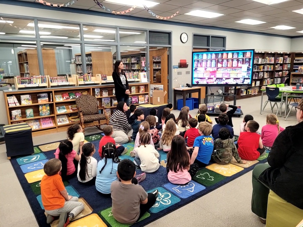 group of students looking at a screen 