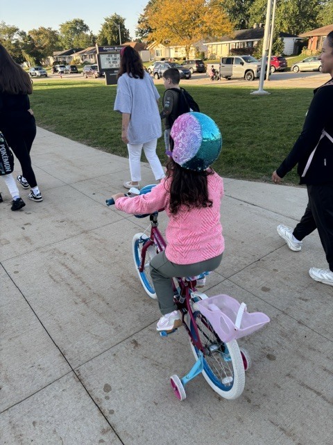students and families on bikes
