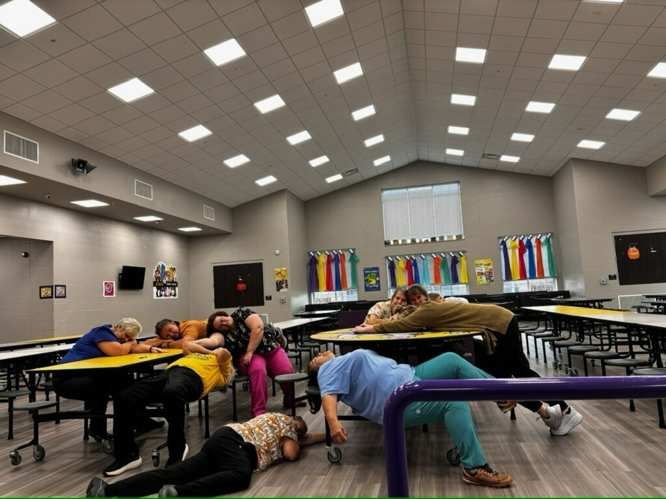 Lunchroom workers tired after serving Thanksgiving meals.