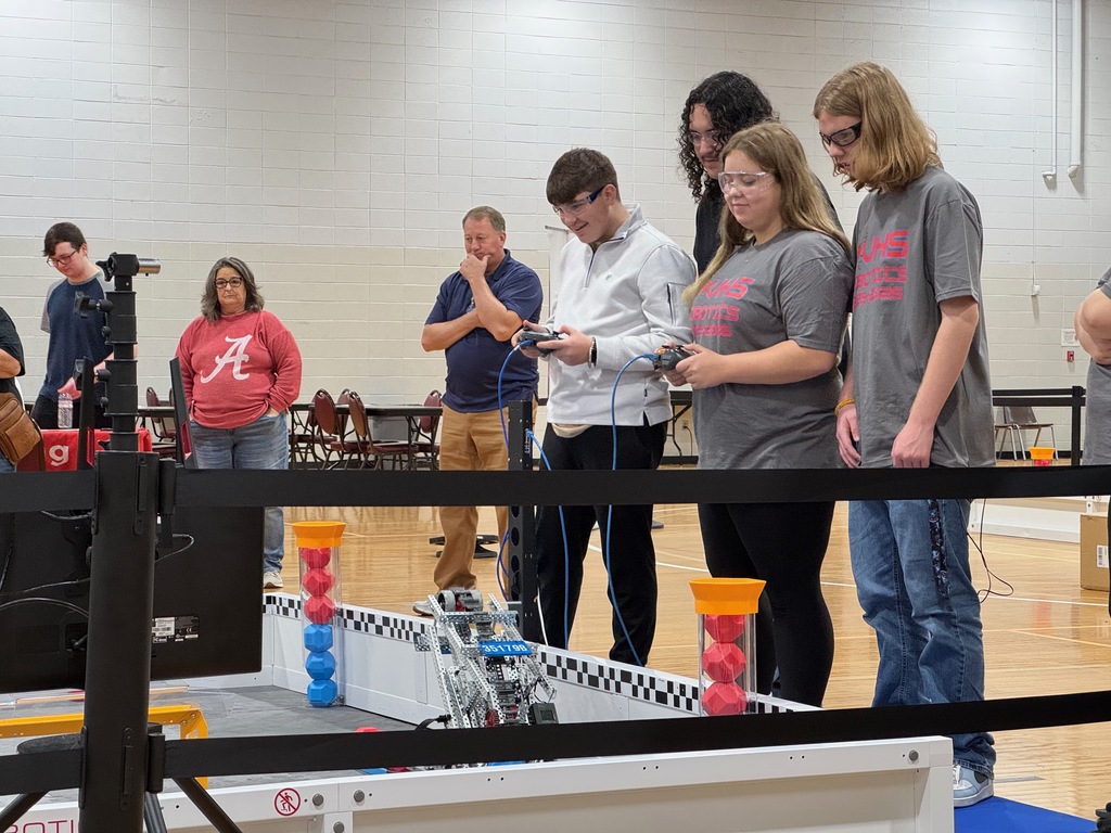Two robotics students competing