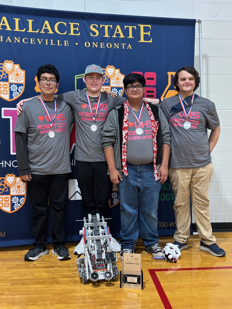 Team 35179A with their robot and first-place trophy