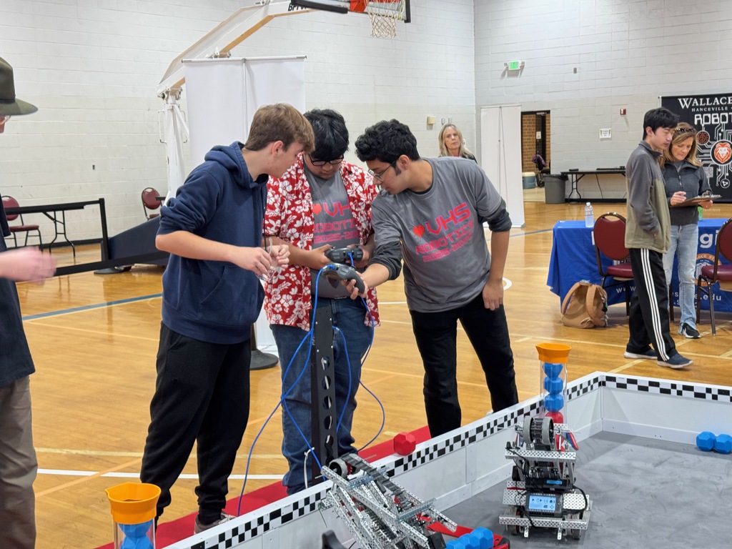 Team 35179A conferring with their alliance partners for a match