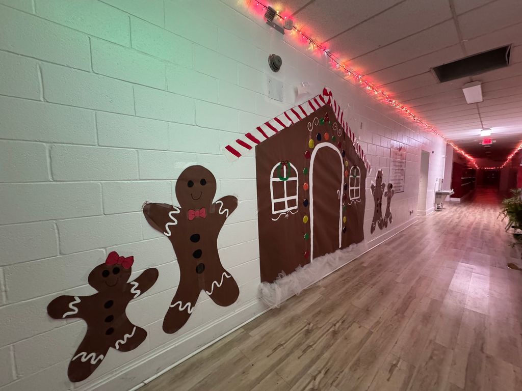 Hall with gingerbread house and gingerbread men and Christmas lights