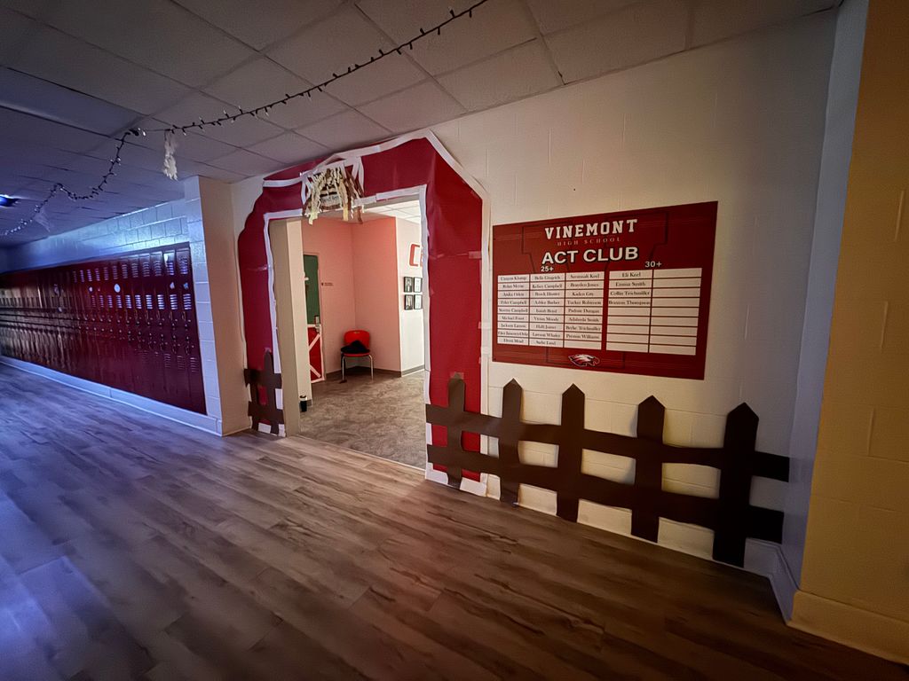 Hall doorway decorated to look like a barn?  Cute paper wooden fence next to open barn