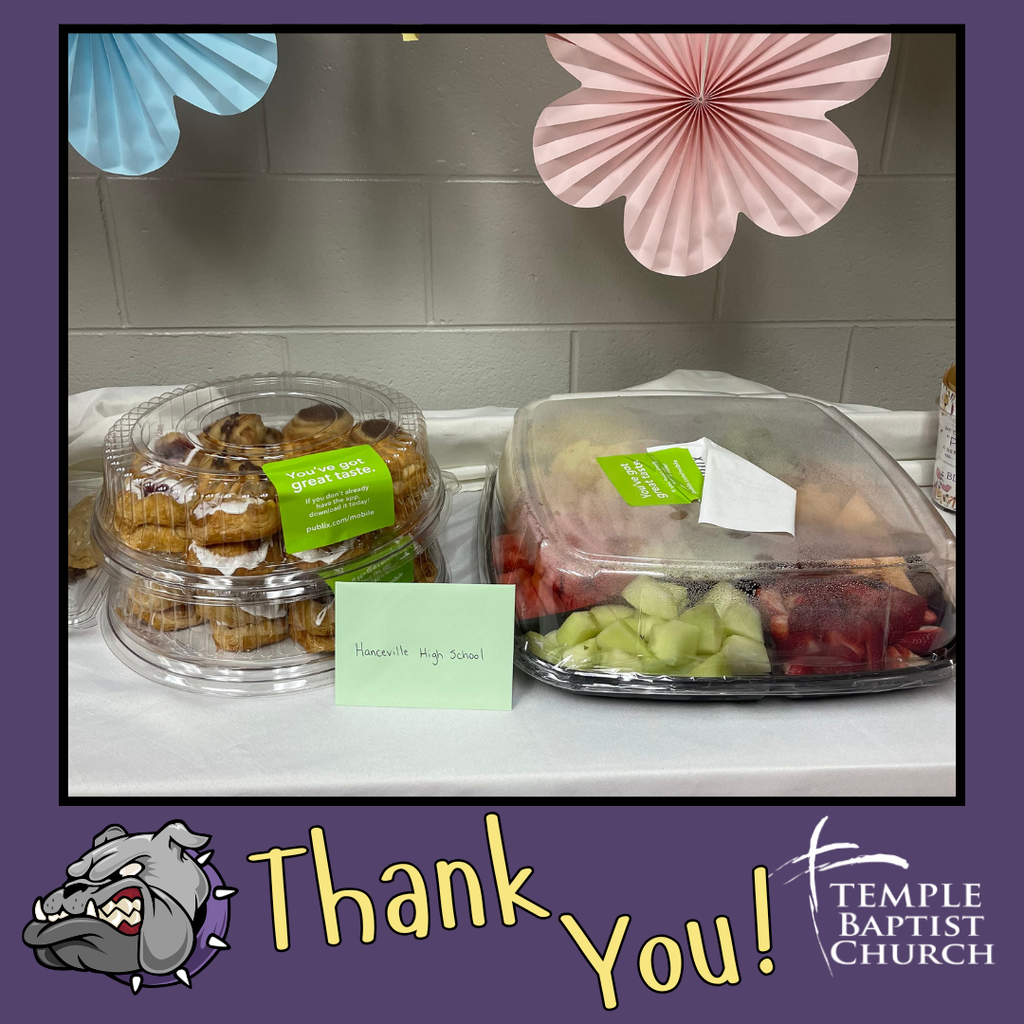 A table with two clear containers, one with pastries and the other with fruit salad. A small note reads "Thank you" to Temple Baptist Church.
