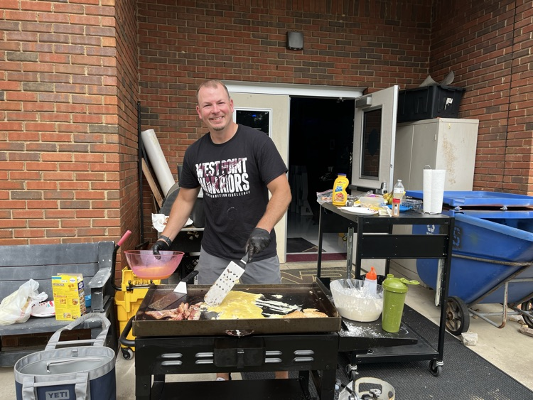 Mr. Jones making breakfast for the faculty