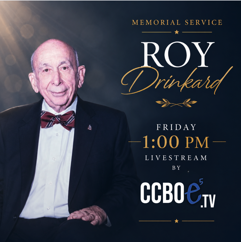 A man in a black suit and red bow tie smiles for a memorial service flyer.