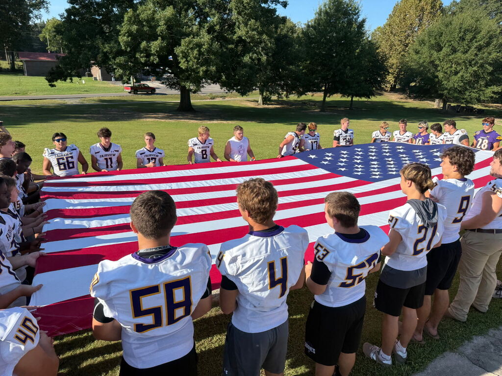 Football team with white jersey and American flag
