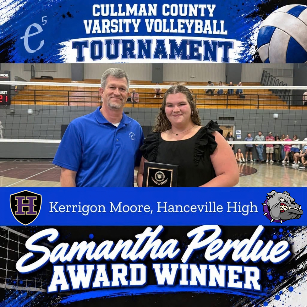 A man and woman stand next to a volleyball, with the woman holding a plaque. The background shows a gym with a volleyball net.