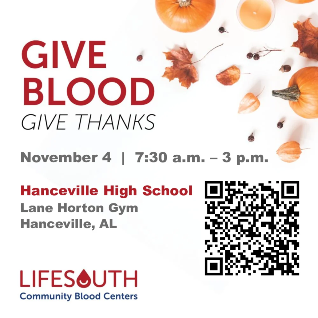 White poster with red text. Pumpkins, leaves, and a QR code. Text reads "Give Blood Give Thanks."