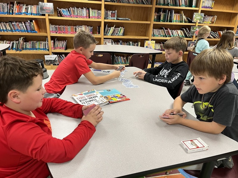 students practicing magic tricks