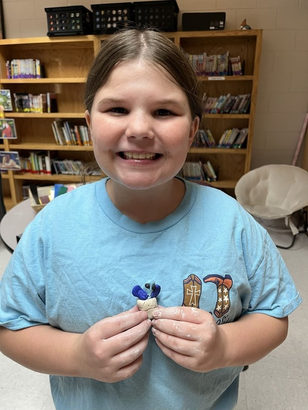 student with sculpture