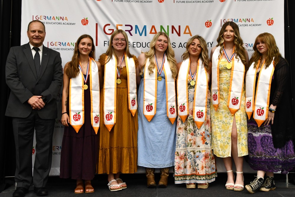 Dr. Tony Brads poses with six Culpeper County Public Schools students during the Future Educators Academy Signing Day celebration. The students, members of the inaugural cohort of the Germanna Future Educators Academy Lab School, announced their plans to continue their teacher preparation programs at four-year universities across Virginia.