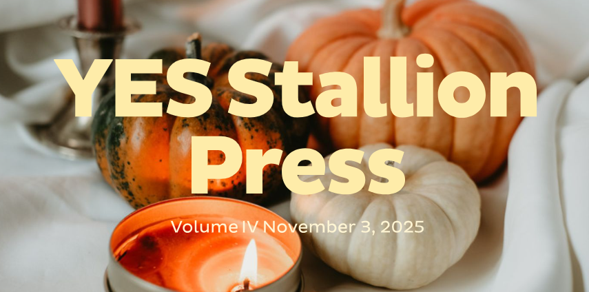 Newsletter cover with a warm autumn scene featuring small pumpkins, a lit candle, and soft neutral fabric in the background. Large bold text in the center reads 'YES Stallion Press.' Smaller text below says 'Volume IV November 3, 2025.
