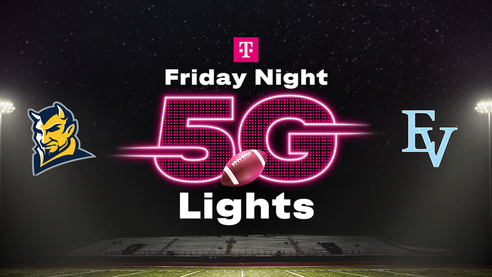 dark sky over a football stadium with CCHS and EVHS logos on the sides, and in the middle the Tmobile logo with 5G Lights in pink in the middle