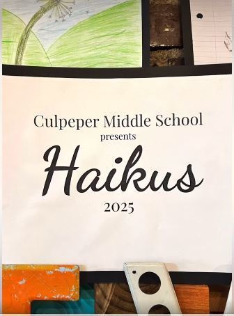 A printed sign reads “Culpeper Middle School presents Haikus 2025.” The sign is surrounded by student artwork, including colorful drawings and lined paper, displayed on a wall.