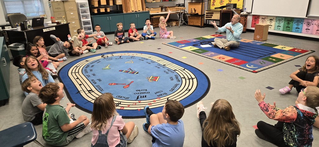 Music teacher doing vocal exercises with students