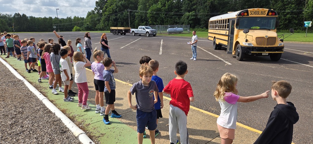 Mr. Jason explaining bus expectations to students